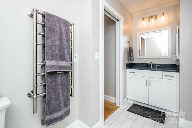 153 Country Ridge Rd, Laurel Park, NC 28739 - bathroom featuring a towel warming rack, vanity, and tile patterned flooring