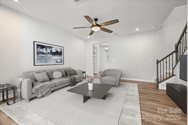 15626 Little Bluestem St, Charlotte, NC 28278 - living room featuring wood finished floors, a ceiling fan, stairway, and recessed lighting