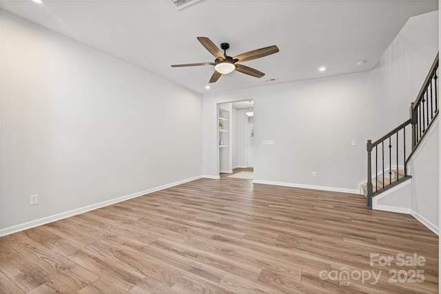 15626 Little Bluestem St, Charlotte, NC 28278 - spare room with ceiling fan, light wood-style floors, stairs, recessed lighting, and a smoke detector