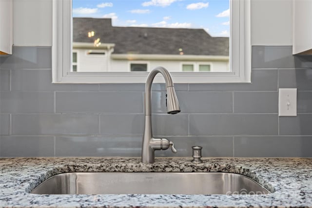 15626 Little Bluestem St, Charlotte, NC 28278 - kitchen view of backsplash, white cabinetry, and light stone countertops