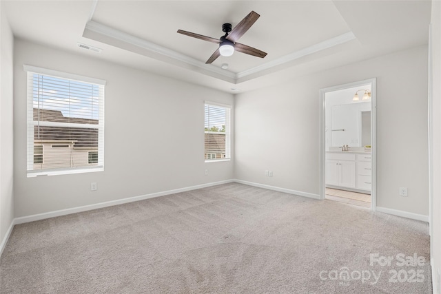 15626 Little Bluestem St, Charlotte, NC 28278 - empty room featuring a tray ceiling, ornamental molding, light colored carpet, and a ceiling fan