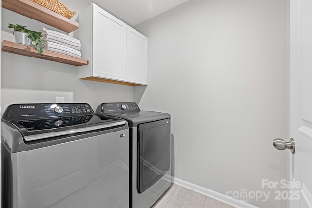 15626 Little Bluestem St, Charlotte, NC 28278 - laundry area featuring independent washer and dryer, cabinet space, and light tile patterned floors