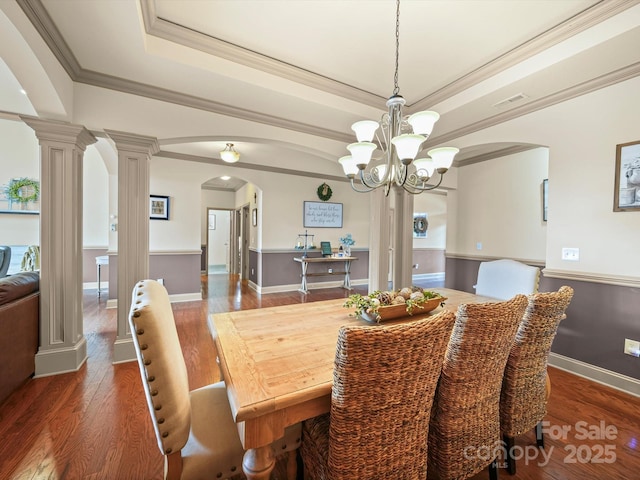 109 Dewfield Ln, Boiling Springs, SC 29316 - dining room with arched walkways, a chandelier, hardwood / wood-style flooring, a tray ceiling, and ornamental molding