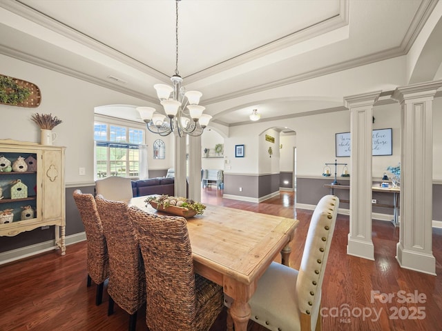 109 Dewfield Ln, Boiling Springs, SC 29316 - dining space with arched walkways, dark wood-style floors, a chandelier, ornate columns, and crown molding