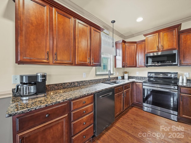 109 Dewfield Ln, Boiling Springs, SC 29316 - kitchen with stainless steel appliances, dark wood finished floors, dark stone counters, pendant lighting, and crown molding