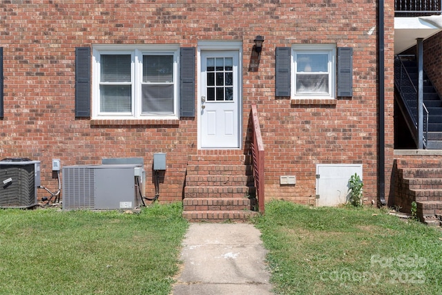 718 E Maple Ave, Gastonia, NC 28054 - view of exterior entry with a yard and brick siding