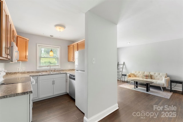718 E Maple Ave, Gastonia, NC 28054 - kitchen featuring white appliances, dark wood-style floors, open floor plan, and hanging light fixtures