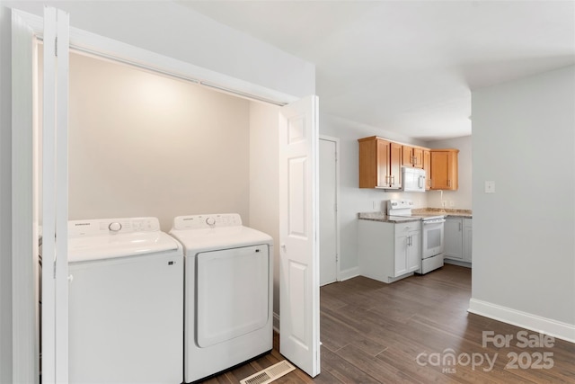 718 E Maple Ave, Gastonia, NC 28054 - laundry area featuring washer and clothes dryer and dark wood finished floors