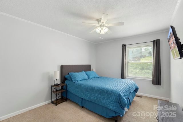 718 E Maple Ave, Gastonia, NC 28054 - bedroom with carpet floors, a textured ceiling, crown molding, and a ceiling fan
