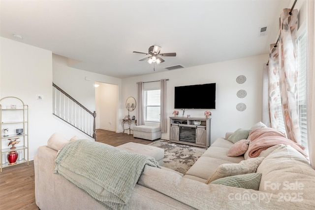 1111 Freeman View Dr, Albemarle, NC 28001 - living room featuring a ceiling fan, stairway, and light wood-style flooring