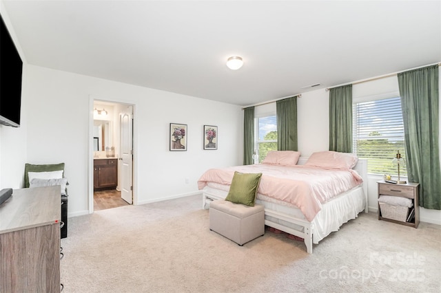 1111 Freeman View Dr, Albemarle, NC 28001 - bedroom with light carpet, multiple windows, and connected bathroom