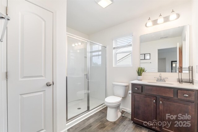 1111 Freeman View Dr, Albemarle, NC 28001 - full bath with vanity, wood finished floors, and a stall shower