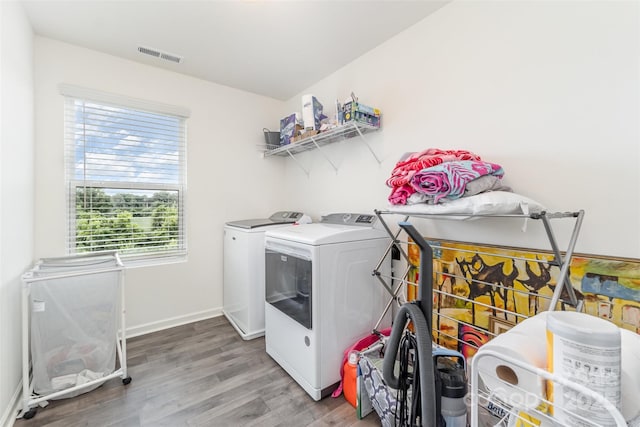 1111 Freeman View Dr, Albemarle, NC 28001 - washroom featuring independent washer and dryer, light wood finished floors, and healthy amount of natural light