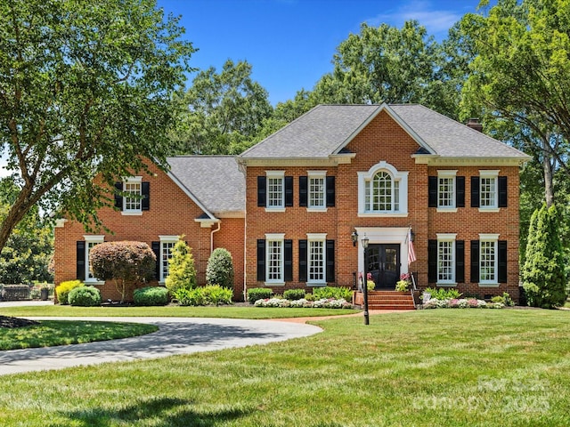 11624 Glenn Abbey Way, Charlotte, NC 28277 - colonial inspired home with brick siding, a front yard, and a shingled roof