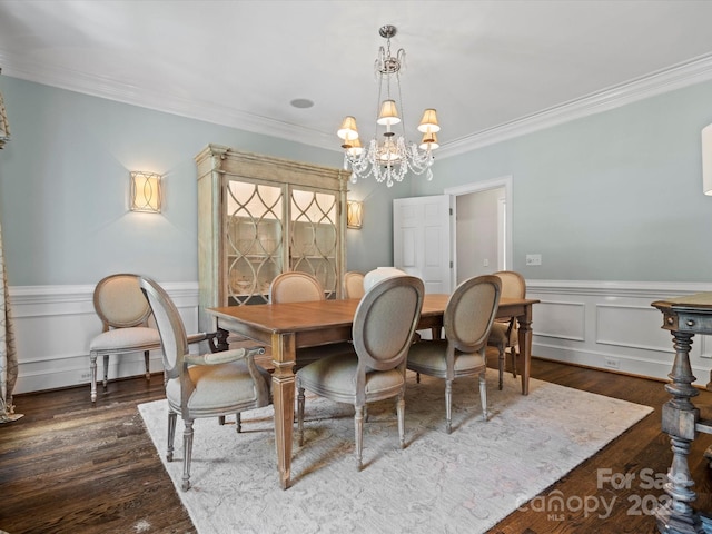 11624 Glenn Abbey Way, Charlotte, NC 28277 - dining room with a chandelier, crown molding, a wainscoted wall, and wood finished floors