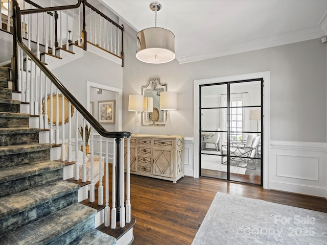 11624 Glenn Abbey Way, Charlotte, NC 28277 - stairway with wood finished floors, ornamental molding, and a wainscoted wall