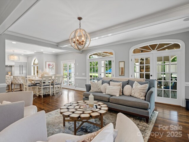 11624 Glenn Abbey Way, Charlotte, NC 28277 - living area featuring a chandelier, dark wood-style flooring, french doors, ornamental molding, and recessed lighting