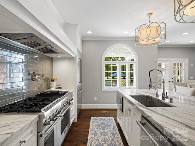 11624 Glenn Abbey Way, Charlotte, NC 28277 - kitchen featuring appliances with stainless steel finishes, white cabinets, decorative backsplash, light stone countertops, and recessed lighting
