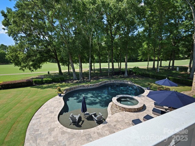11624 Glenn Abbey Way, Charlotte, NC 28277 - view of swimming pool featuring a yard, a patio area, a pool with connected hot tub, view of scattered trees, and view of golf course