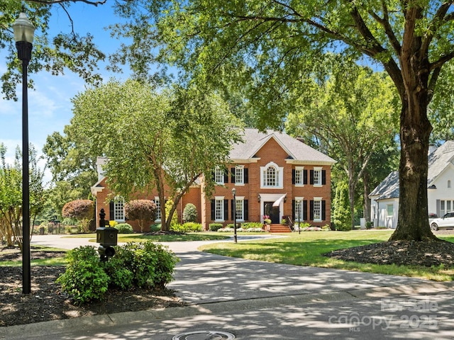 11624 Glenn Abbey Way, Charlotte, NC 28277 - georgian-style home featuring brick siding and a front yard
