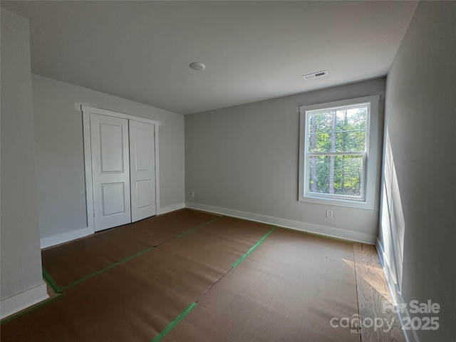 617 Autumnlight Dr, Salisbury, NC 28147 - unfurnished bedroom with baseboards and a closet