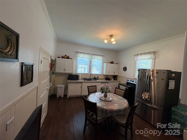 43 Mandalay Pl SW, Concord, NC 28027 - dining space featuring crown molding, dark wood-style flooring, plenty of natural light, and a chandelier