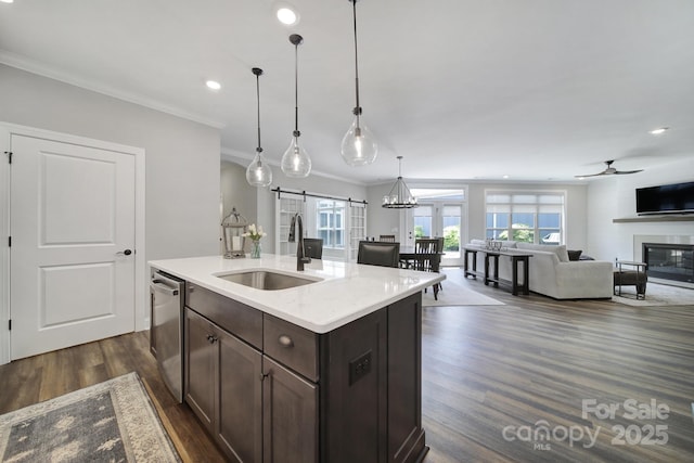 2019 Trailwood Dr, Matthews, NC 28104 - kitchen with stainless steel dishwasher, dark wood-style flooring, dark brown cabinets, ornamental molding, and open floor plan