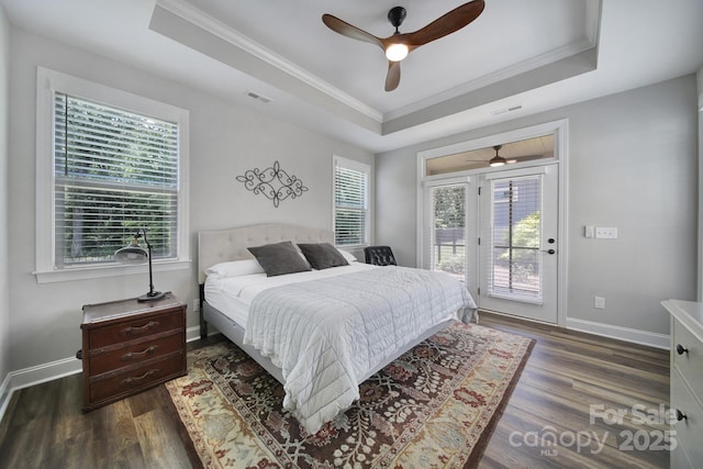 2019 Trailwood Dr, Matthews, NC 28104 - bedroom featuring a tray ceiling, access to exterior, crown molding, wood finished floors, and ceiling fan