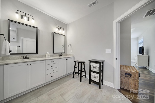 2019 Trailwood Dr, Matthews, NC 28104 - bathroom featuring double vanity and baseboards