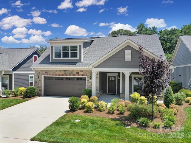 2019 Trailwood Dr, Matthews, NC 28104 - craftsman inspired home with a shingled roof, a porch, driveway, a garage, and stone siding