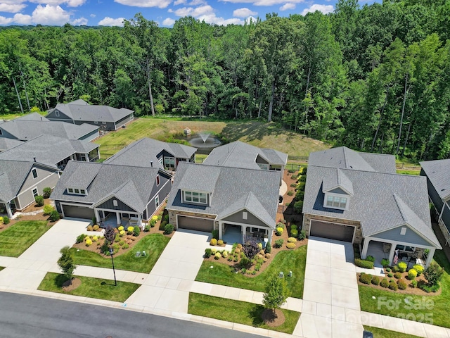 2019 Trailwood Dr, Matthews, NC 28104 - aerial perspective of suburban area featuring a heavily wooded area