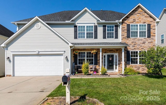172 Roanoke Rd, Fletcher, NC 28732 - view of front of home featuring a front lawn, concrete driveway, stone siding, and covered porch