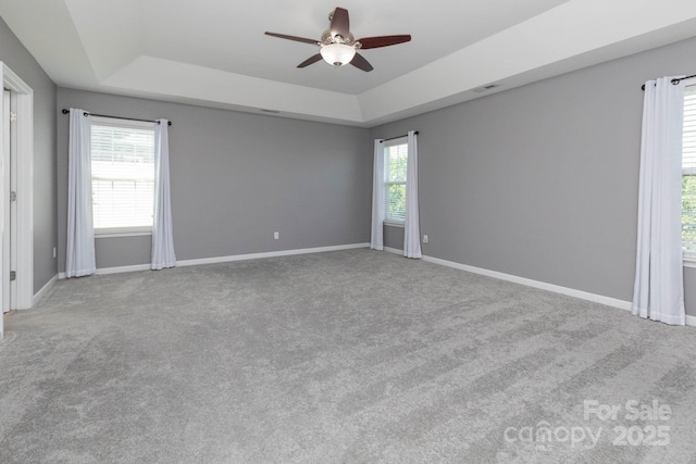172 Roanoke Rd, Fletcher, NC 28732 - carpeted empty room with a tray ceiling and ceiling fan