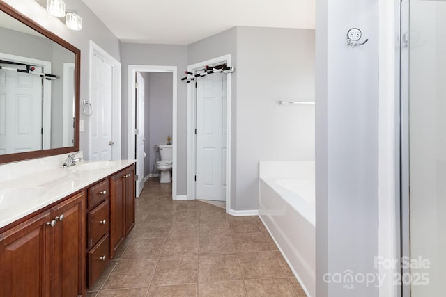 172 Roanoke Rd, Fletcher, NC 28732 - bathroom with double vanity, a garden tub, and tile patterned flooring