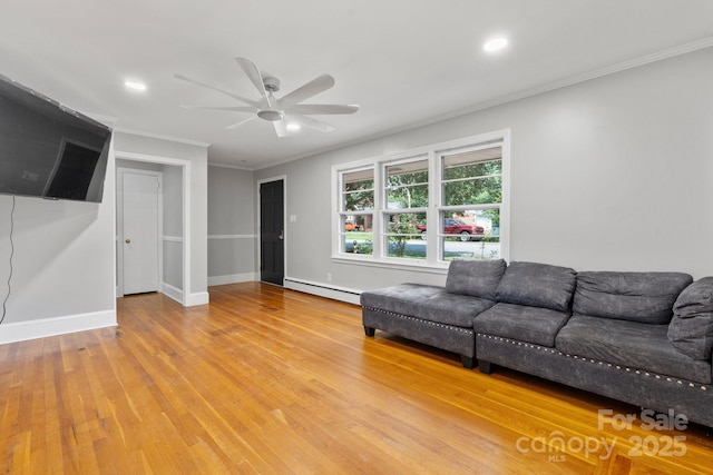 524 Bonview Ave, Lincolnton, NC 28092 - living room with a baseboard radiator, a ceiling fan, ornamental molding, light wood finished floors, and recessed lighting