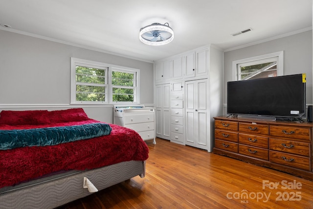 524 Bonview Ave, Lincolnton, NC 28092 - bedroom with light wood-type flooring, crown molding, and a closet