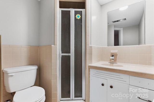 524 Bonview Ave, Lincolnton, NC 28092 - full bathroom featuring vanity, tile walls, and a shower stall