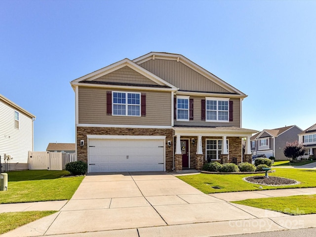 1374 Kent Downs Ave SW, Concord, NC 28027 - craftsman-style house featuring a garage, driveway, stone siding, and covered porch