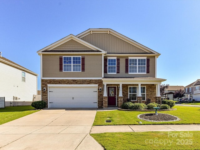 1374 Kent Downs Ave SW, Concord, NC 28027 - craftsman-style home with a front lawn, stone siding, a garage, and concrete driveway