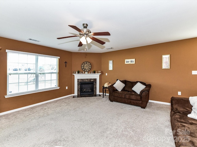 1374 Kent Downs Ave SW, Concord, NC 28027 - carpeted living room with a ceiling fan and a fireplace