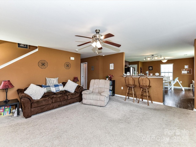 1374 Kent Downs Ave SW, Concord, NC 28027 - living room featuring dark carpet and a ceiling fan
