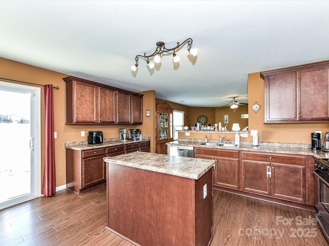 1374 Kent Downs Ave SW, Concord, NC 28027 - kitchen with dark wood finished floors, a center island, stainless steel appliances, and a peninsula