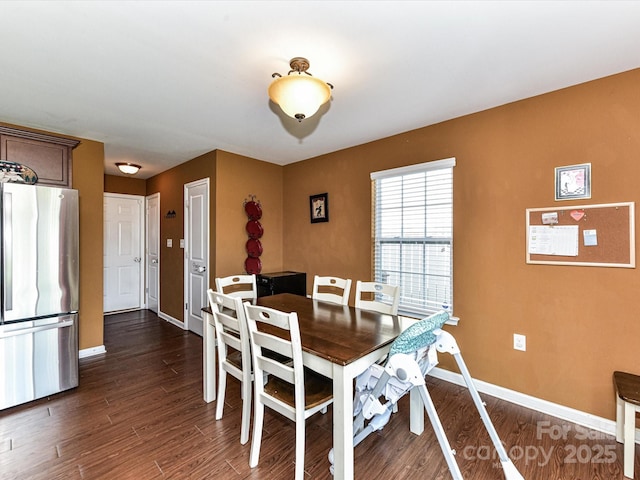 1374 Kent Downs Ave SW, Concord, NC 28027 - dining room with baseboards and dark wood-type flooring