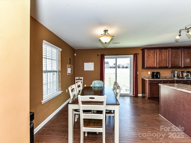 1374 Kent Downs Ave SW, Concord, NC 28027 - dining room with dark wood finished floors and baseboards