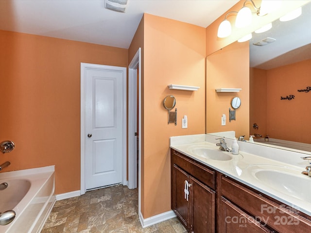 1374 Kent Downs Ave SW, Concord, NC 28027 - full bath with a bath, double vanity, and stone finish flooring