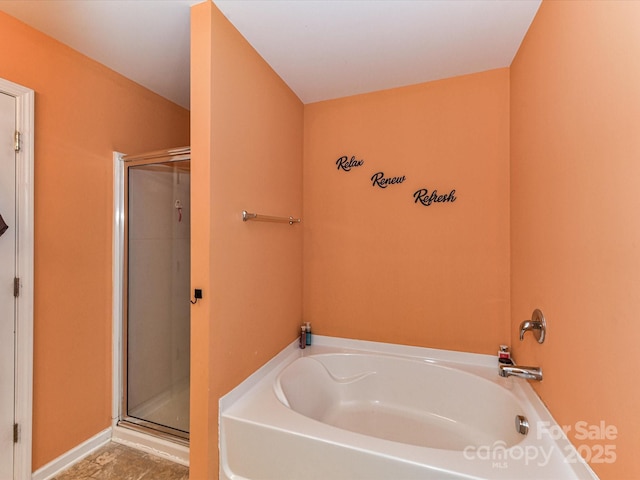 1374 Kent Downs Ave SW, Concord, NC 28027 - bathroom featuring a garden tub and a shower stall
