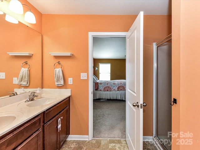 1374 Kent Downs Ave SW, Concord, NC 28027 - bathroom featuring connected bathroom, double vanity, and a shower with shower door