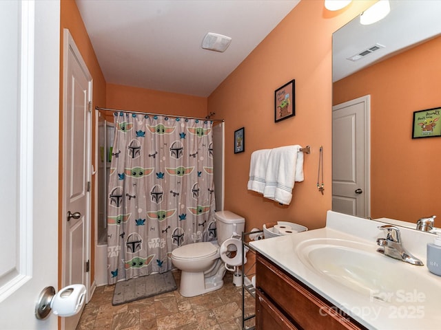 1374 Kent Downs Ave SW, Concord, NC 28027 - bathroom featuring vanity, stone finish floors, and shower / tub combo with curtain