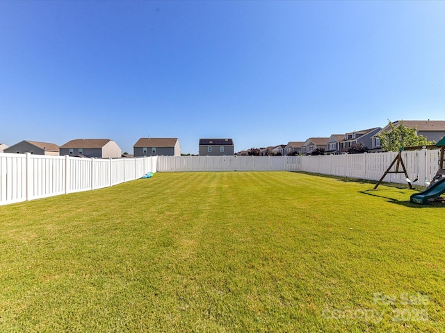 1374 Kent Downs Ave SW, Concord, NC 28027 - fenced backyard with a residential view and a playground