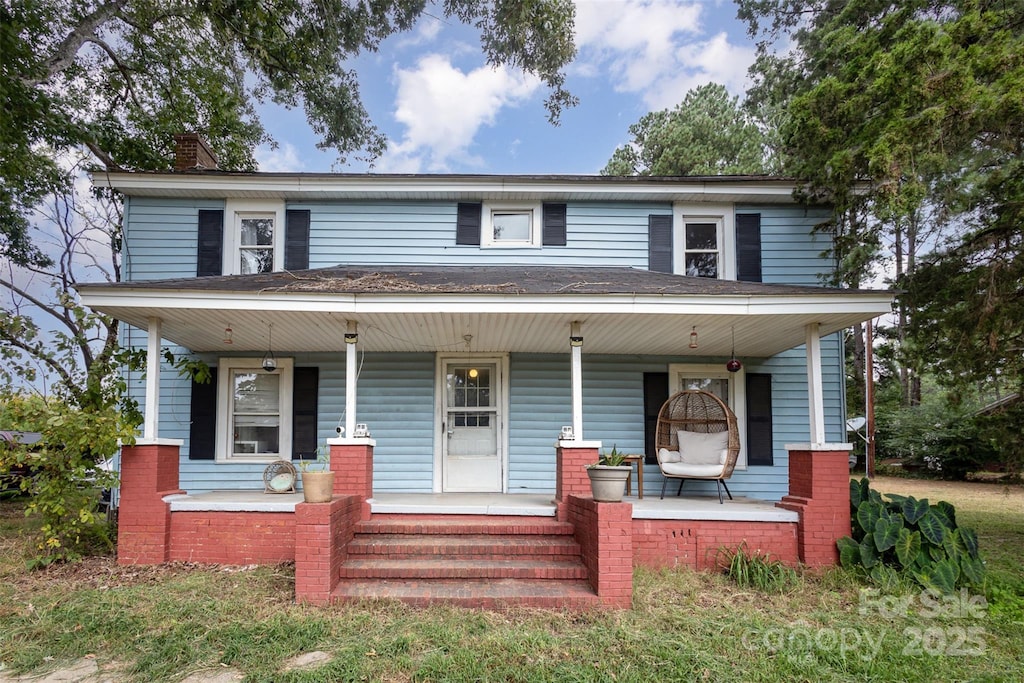 12137 Renee Ford Rd Unit 3, Stanfield, NC 28163 - view of front of home with a porch, a chimney, and roof with shingles